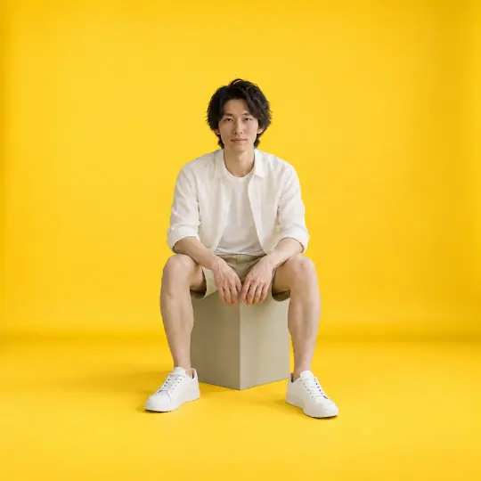Kenji, an A Pose Studio model, wearing or holding the shoes in the Mustard Studio scene